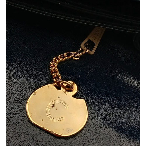 1202 - A Céline Vintage Navy Triomphe Shoulder Bag. Navy leather exterior with gold-tone hardware, Triomphe... 