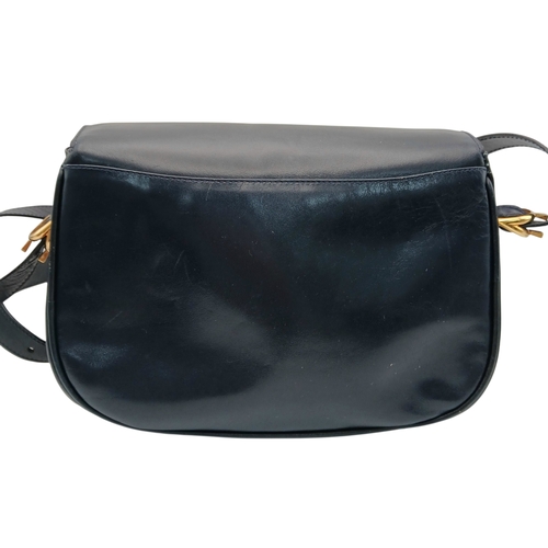 1202 - A Céline Vintage Navy Triomphe Shoulder Bag. Navy leather exterior with gold-tone hardware, Triomphe... 
