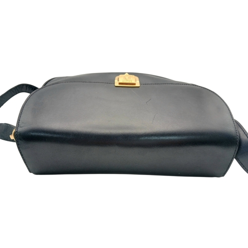 1202 - A Céline Vintage Navy Triomphe Shoulder Bag. Navy leather exterior with gold-tone hardware, Triomphe... 