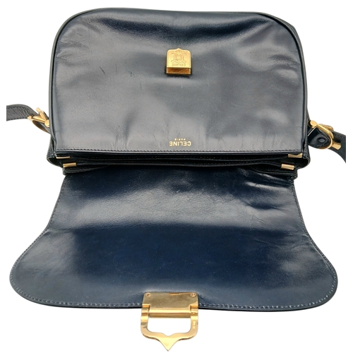 1202 - A Céline Vintage Navy Triomphe Shoulder Bag. Navy leather exterior with gold-tone hardware, Triomphe... 