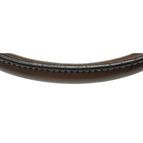 1216 - A Prada Beige Canvas and Brown Leather Tote Bag. Crafted in beige canvas with an embroidered “PRADA ... 