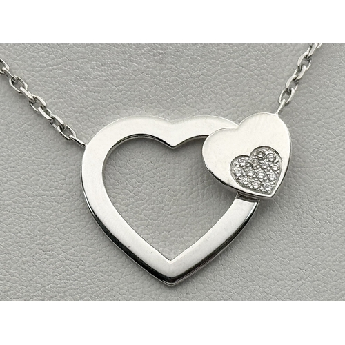 1229 - An 18K White Gold and Diamond 