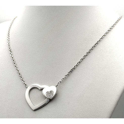 1229 - An 18K White Gold and Diamond 