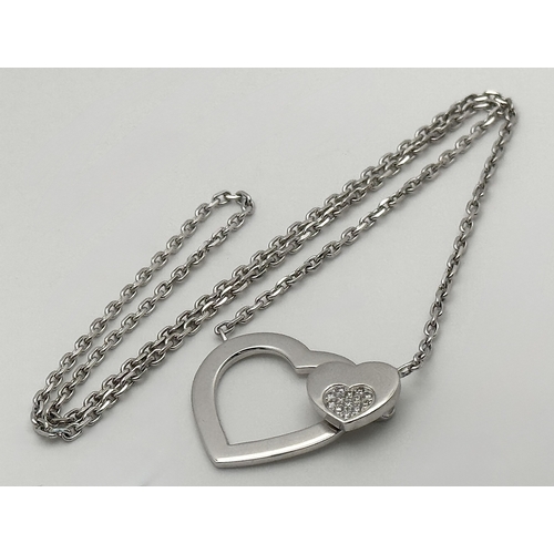 1229 - An 18K White Gold and Diamond 