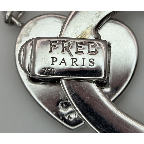 1229 - An 18K White Gold and Diamond 