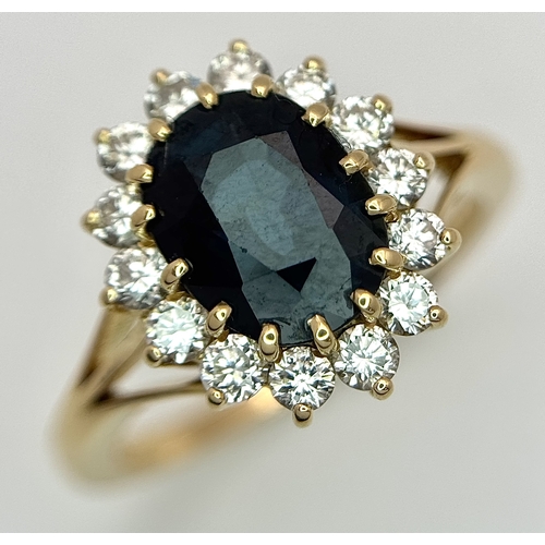 1243 - A Classic 18K Yellow Gold, Sapphire and Diamond Ring. Gorgeous 2ct oval cut green sapphire with 0.70... 