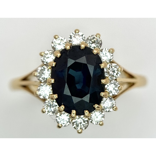 1243 - A Classic 18K Yellow Gold, Sapphire and Diamond Ring. Gorgeous 2ct oval cut green sapphire with 0.70... 