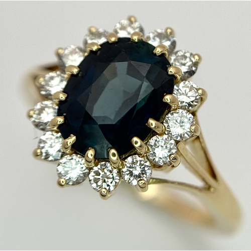 1243 - A Classic 18K Yellow Gold, Sapphire and Diamond Ring. Gorgeous 2ct oval cut green sapphire with 0.70... 