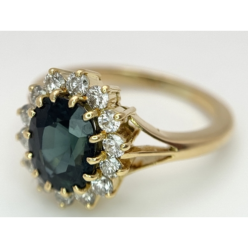 1243 - A Classic 18K Yellow Gold, Sapphire and Diamond Ring. Gorgeous 2ct oval cut green sapphire with 0.70... 