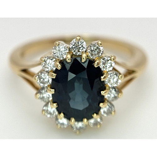 1243 - A Classic 18K Yellow Gold, Sapphire and Diamond Ring. Gorgeous 2ct oval cut green sapphire with 0.70... 