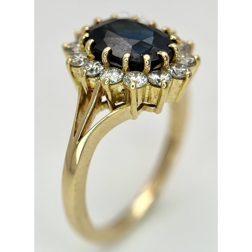 1243 - A Classic 18K Yellow Gold, Sapphire and Diamond Ring. Gorgeous 2ct oval cut green sapphire with 0.70... 