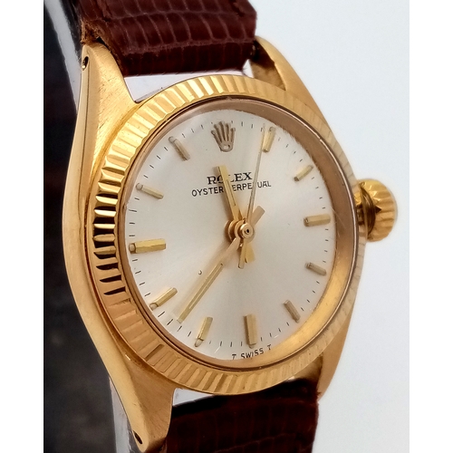 177 - A 18K Gold Rolex Oyster Perpetual Gold Ladies Automatic Watch. Brown leather strap. 18K gold case. S... 