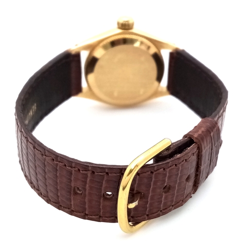 177 - A 18K Gold Rolex Oyster Perpetual Gold Ladies Automatic Watch. Brown leather strap. 18K gold case. S... 