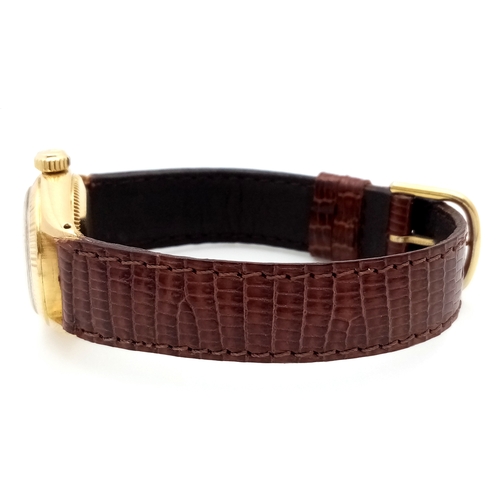 177 - A 18K Gold Rolex Oyster Perpetual Gold Ladies Automatic Watch. Brown leather strap. 18K gold case. S... 