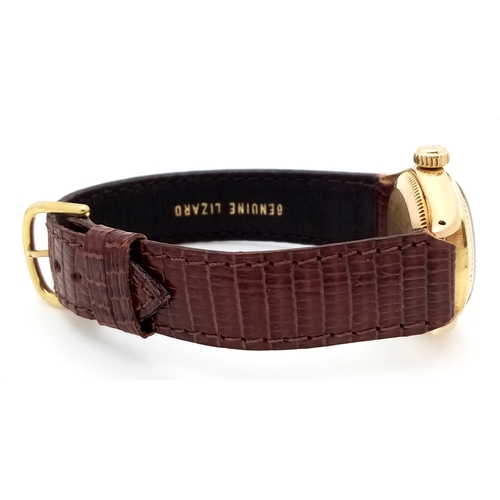 177 - A 18K Gold Rolex Oyster Perpetual Gold Ladies Automatic Watch. Brown leather strap. 18K gold case. S... 