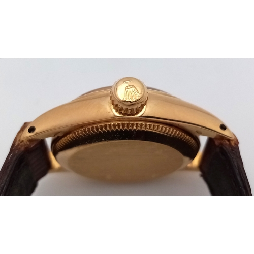 177 - A 18K Gold Rolex Oyster Perpetual Gold Ladies Automatic Watch. Brown leather strap. 18K gold case. S... 