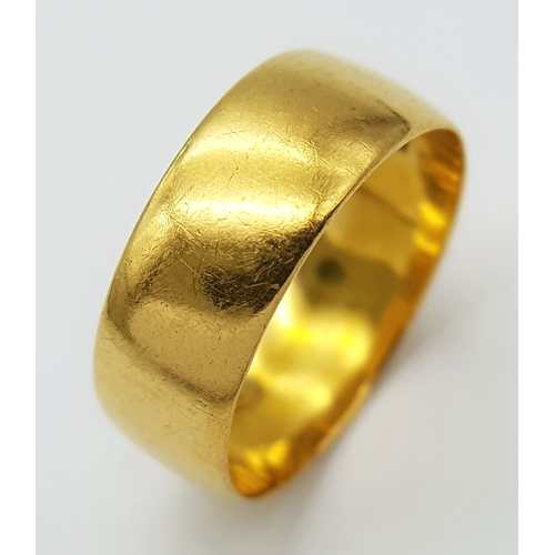 324 - A 22K GOLD BAND RING (6mm width) .       2.9gms     size J