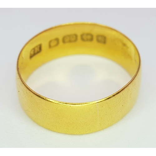 324 - A 22K GOLD BAND RING (6mm width) .       2.9gms     size J