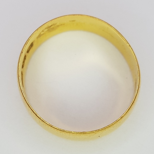 324 - A 22K GOLD BAND RING (6mm width) .       2.9gms     size J