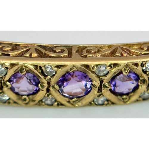 93 - A VINTAGE 9K GOLD HINGED BANGLE WITH DECORATIVE SIDES AND DIAMOND AND AMETHYST TOP STONES .    13.2g... 