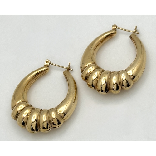 58 - A LARGE PAIR OF HORSESHOE HOOP EARRINGS IN 9K GOLD. 35mm LENGTH. 4.1gms