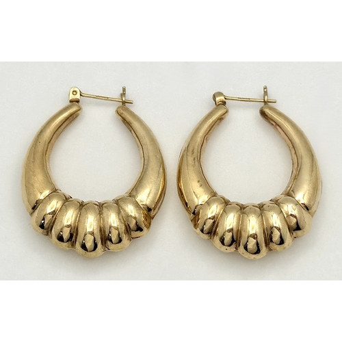 58 - A LARGE PAIR OF HORSESHOE HOOP EARRINGS IN 9K GOLD. 35mm LENGTH. 4.1gms