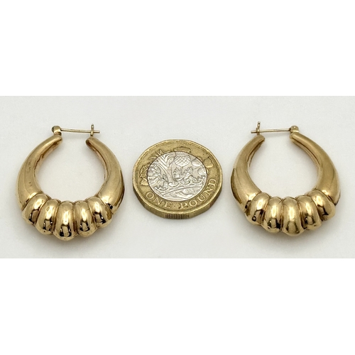 58 - A LARGE PAIR OF HORSESHOE HOOP EARRINGS IN 9K GOLD. 35mm LENGTH. 4.1gms