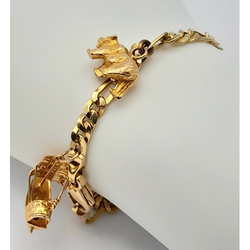 646 - A 14K GOLD CHARM BRACELET WITH 6 CHARMS .     21.9gms 
   19cms