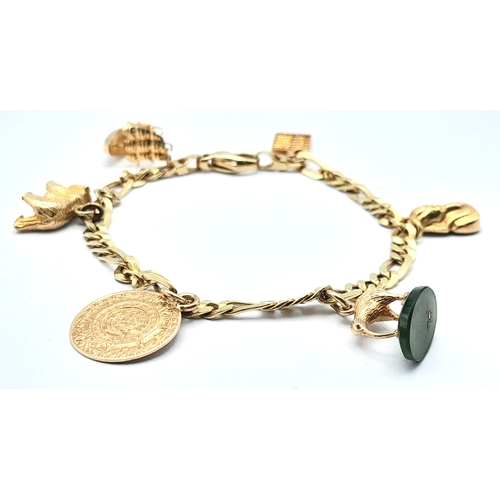 646 - A 14K GOLD CHARM BRACELET WITH 6 CHARMS .     21.9gms 
   19cms