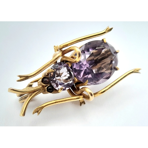 79 - AN ANTIQUE 9K GOLD AND AMETHYST BEETLE BROOCH .   4.2gms