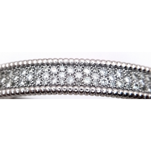 1168 - A 14K WHITE GOLD, DIAMOND SET BANGLE. 4.50 CTW. 29.2G. TAN 7001