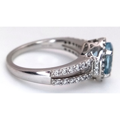 1175 - AN 18K WHITE GOLD, DIAMOND AND AQUAMARINE SET, SPLIT SHANK RING. 0.50 CTW OF DIAMONDS WITH A 2.00 CT... 