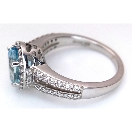 1175 - AN 18K WHITE GOLD, DIAMOND AND AQUAMARINE SET, SPLIT SHANK RING. 0.50 CTW OF DIAMONDS WITH A 2.00 CT... 