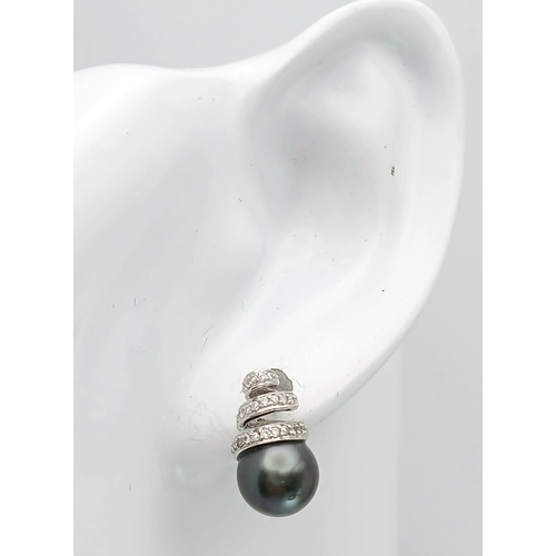 1244 - A PAIR OF 18K WHITE GOLD, DIAMOND AND PEARL, SPIRAL DESIGN, DROP EARRINGS. 4G. MS RED 1011