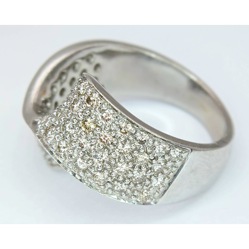1258 - A 9K WHITE GOLD, DIAMOND SET, FANCY WAVE DESIGN RING. 1.25 CTW. 7.6G, SIZE N/O. SPSA 1002