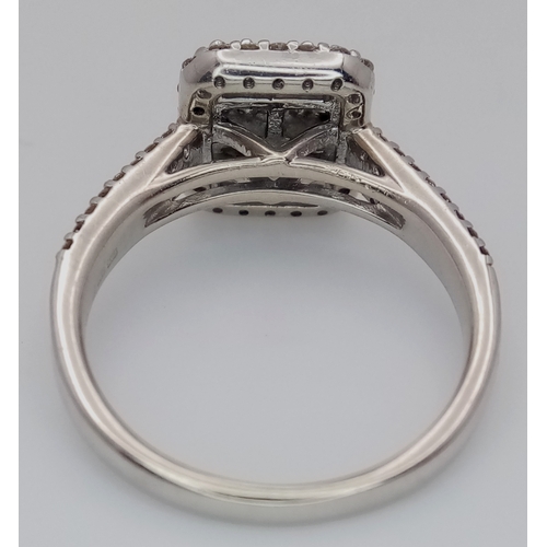 1265 - A 9K WHITE GOLD, FANCY DIAMOND SET, CLUSTER RING. 0.80 CTW. 4.4G, SIZE N. SPSA 1004