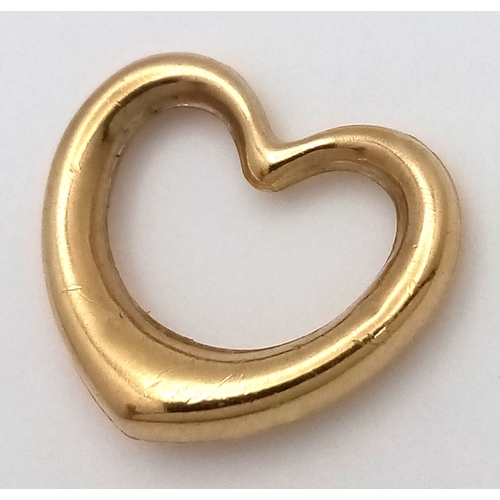 612 - A 9K GOLD OPEN HEART PENDANT .    .5gm