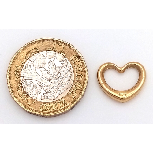612 - A 9K GOLD OPEN HEART PENDANT .    .5gm