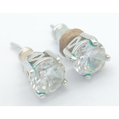 633 - A PAIR OF CZ STUD EARRINGS SET IN 9K WHITE GOLD .1.6gms
