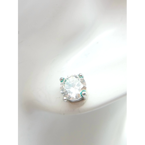 633 - A PAIR OF CZ STUD EARRINGS SET IN 9K WHITE GOLD .1.6gms