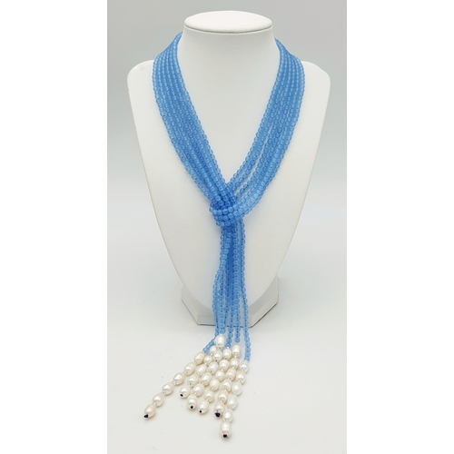 654 - An Aquamarine and Freshwater Pearl Three Strand Scarf Necklace. 123cm strands.