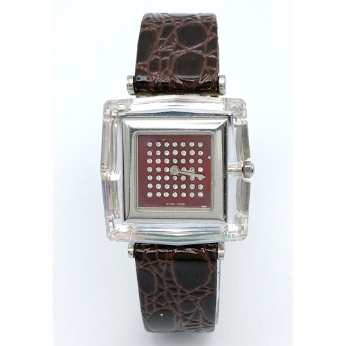 684 - A SWAROVSKI, BROWN LEATHER STRAP WATCH. IN A SWAROVSKI BOX. IN FULL WORKING ORDER. NEW BATTERY FITTE... 