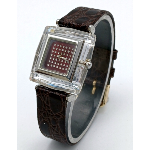 684 - A SWAROVSKI, BROWN LEATHER STRAP WATCH. IN A SWAROVSKI BOX. IN FULL WORKING ORDER. NEW BATTERY FITTE... 