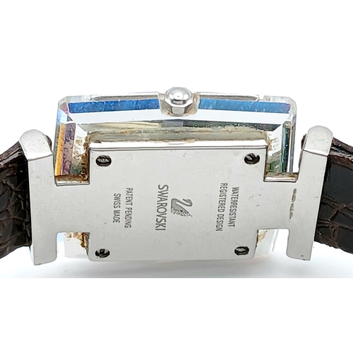 684 - A SWAROVSKI, BROWN LEATHER STRAP WATCH. IN A SWAROVSKI BOX. IN FULL WORKING ORDER. NEW BATTERY FITTE... 