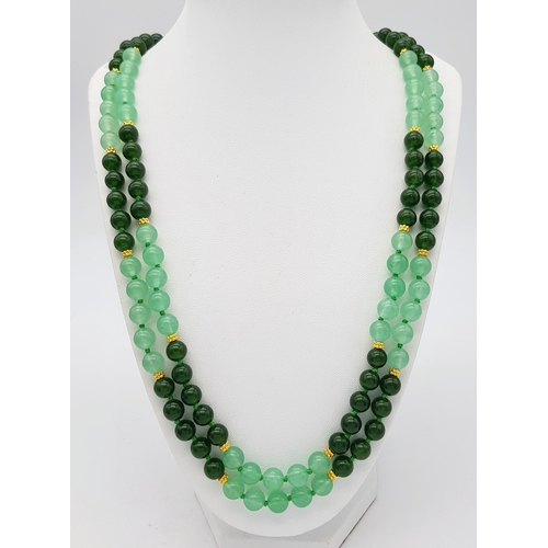 647 - A Pale and Dark Green Jade Rope Length Necklace. 8mm jade beads. 130cm length.