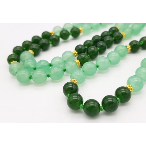 647 - A Pale and Dark Green Jade Rope Length Necklace. 8mm jade beads. 130cm length.