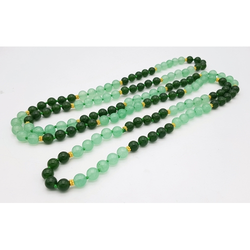 647 - A Pale and Dark Green Jade Rope Length Necklace. 8mm jade beads. 130cm length.