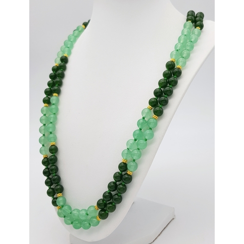 647 - A Pale and Dark Green Jade Rope Length Necklace. 8mm jade beads. 130cm length.