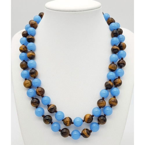 661 - A Light Blue Jade and Tigers Eye Beaded Matinee Necklace. 10mm beads. 92cm necklace length.