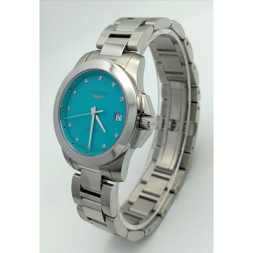 668 - A Longines Conquest Quartz Ladies Watch. Stainless steel bracelet and case - 34mm. Tiffany blue dial... 